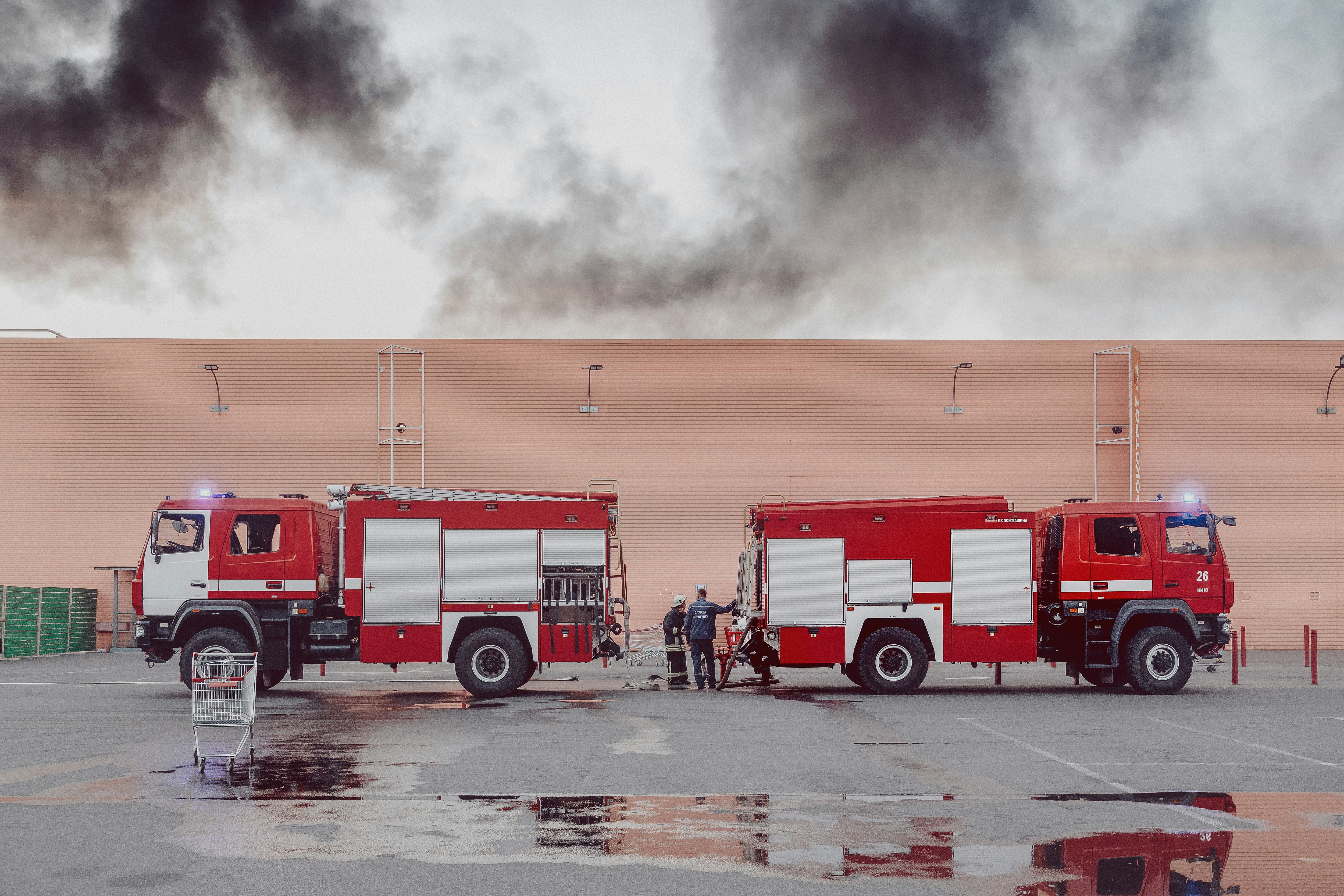 two red and white fire-ruck during daytime